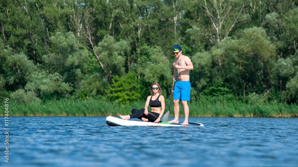 young couple paddling on sup board01