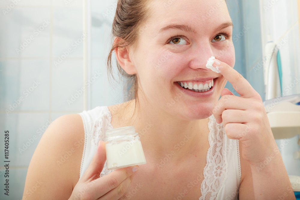 Woman applying moisturizing skin cream. Skincare. Woman applying moisturizing skin cream. Skincare.