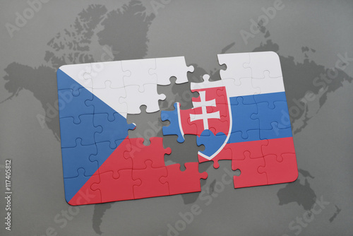 puzzle with the national flag of czech republic and slovakia on a world map background. photo