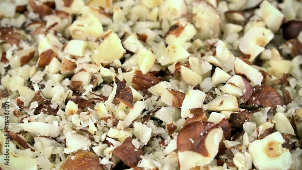 Rotating minced Hazelnuts as not loopable 4K UHD footage Rotating minced Hazelnuts as not loopable 4K UHD footage