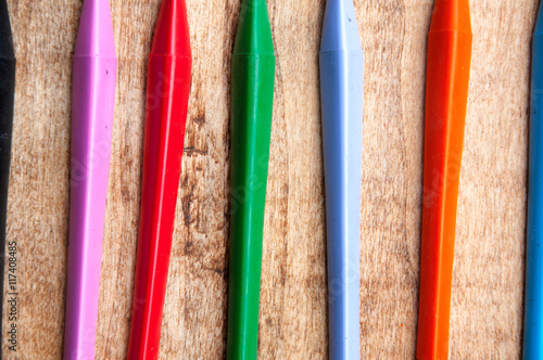 Shot of the tips of rotating colorful crayons