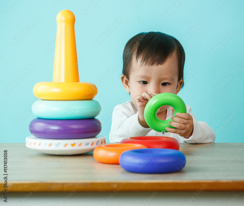 kid boy playing with building blocks at home or kindergarten kid boy playing with building blocks at home or kindergarten