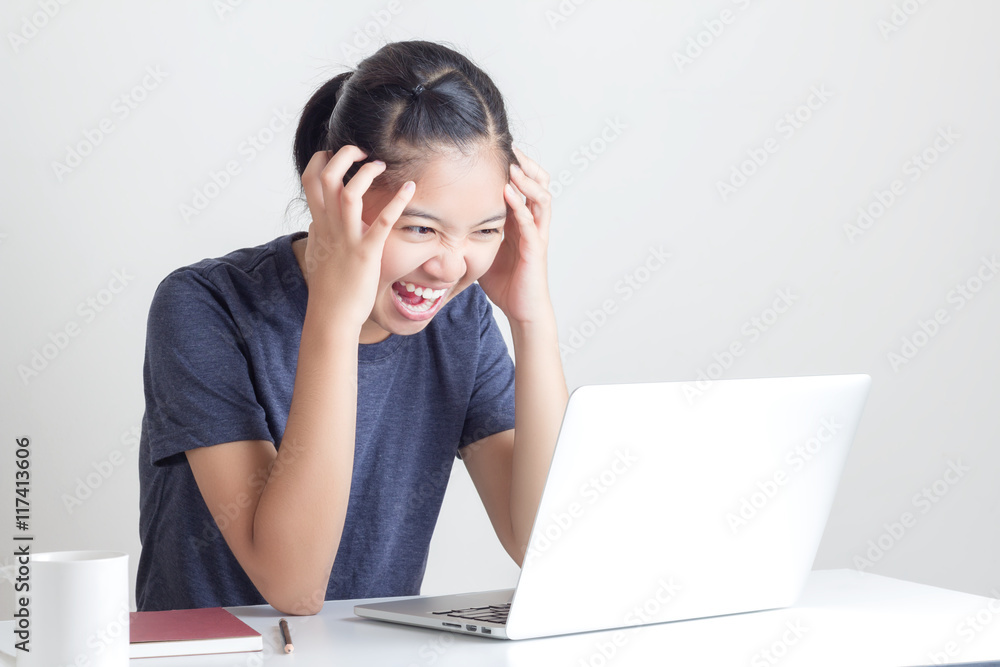 Portrait of tired Young Beautiful Woman Using Laptop at the offi Portrait of tired Young Beautiful Woman Using Laptop at the offi