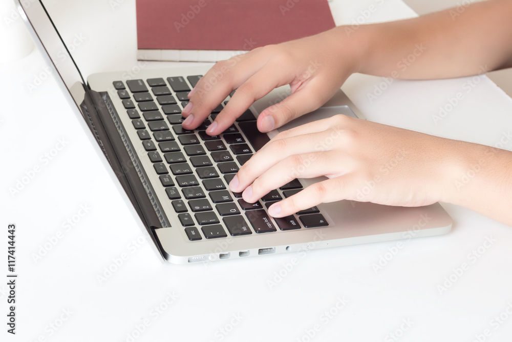 Closeup of woman's hand working with laptop, selective focus Closeup of woman's hand working with laptop, selective focus