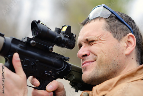 civil man aiming sight