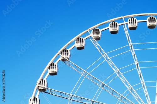 Ferris wheel on blue sky 