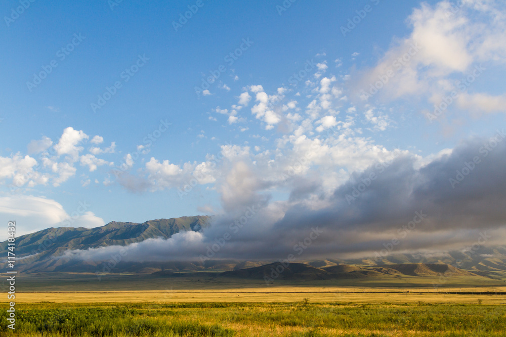 low clouds in the desert in front of the mountains low clouds in the desert in front of the mountains