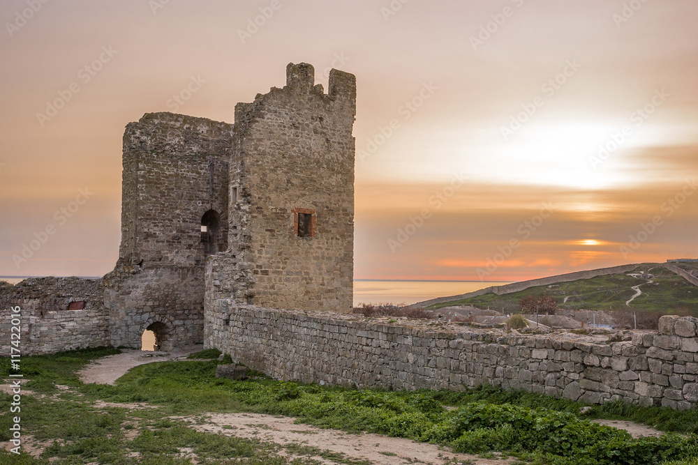 the ruins of the ancient fortress at sunset the ruins of the ancient fortress at sunset