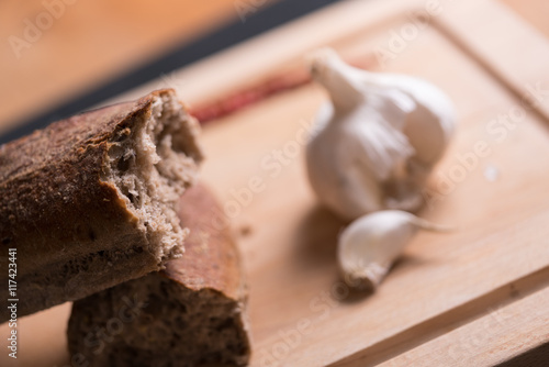 Freshly baked bread on a wooden plate