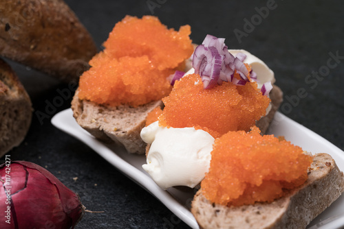 Appetizing starter with Swedish caviar on bread