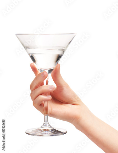 Female hand holding clean martini glass with water