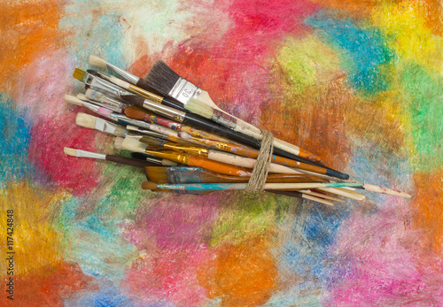 Brushes on a colorful background. The workplace of the artist. Banner for school