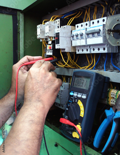Electrician with multimeter