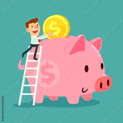 businessman put gold coin in his piggy bank