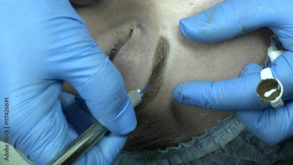 Microblading procedure. Master works with the eyebrows. Semi-permanent make-up. Microblading procedure. Master works with the eyebrows. Semi-permanent make-up.