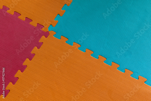 Slika na platnu Orange blue and red playroom foam floor tiles