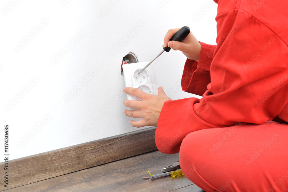 Female electrician fixing electricity problem Female electrician fixing electricity problem