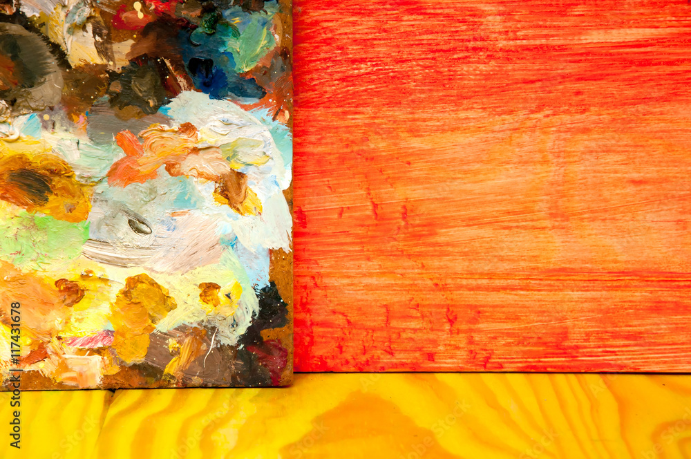 Fototapeta premium Painting palette on colored wooden background