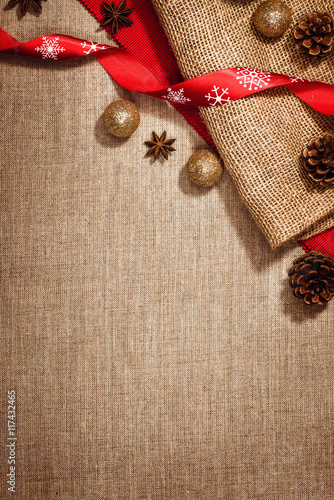 Christmas decoration background over linen background. Vertical photo taken from above  top view with copy space for text and other web or print design elements.