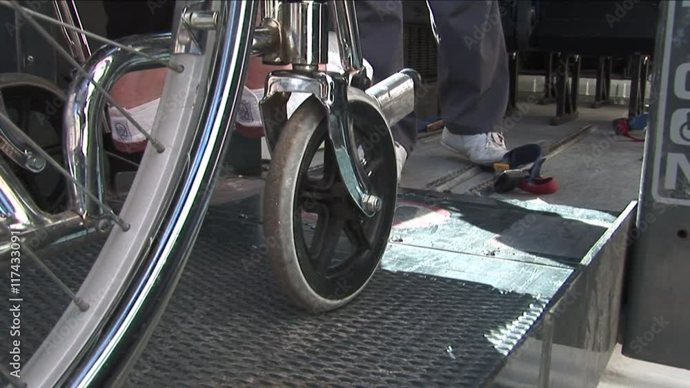 Wheelchair being placed on ramp Wheelchair being placed on ramp