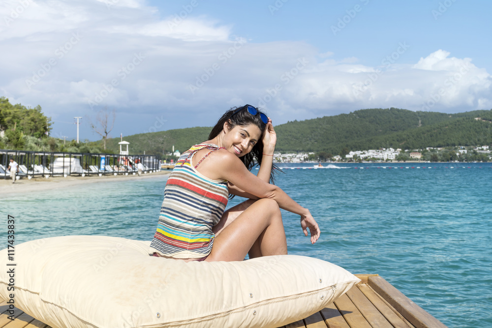 portrait of beautiful young woman relaxing on the beach.Summer holiday