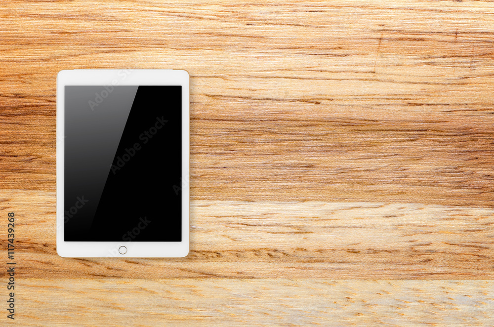 Digital tablet on wooden background. Digital tablet on wooden background.