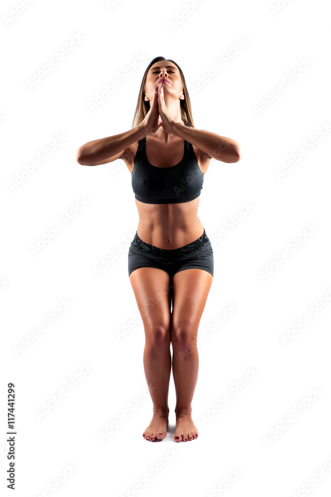 Woman practicing Yoga in a Studio Woman practicing Yoga in a Studio
