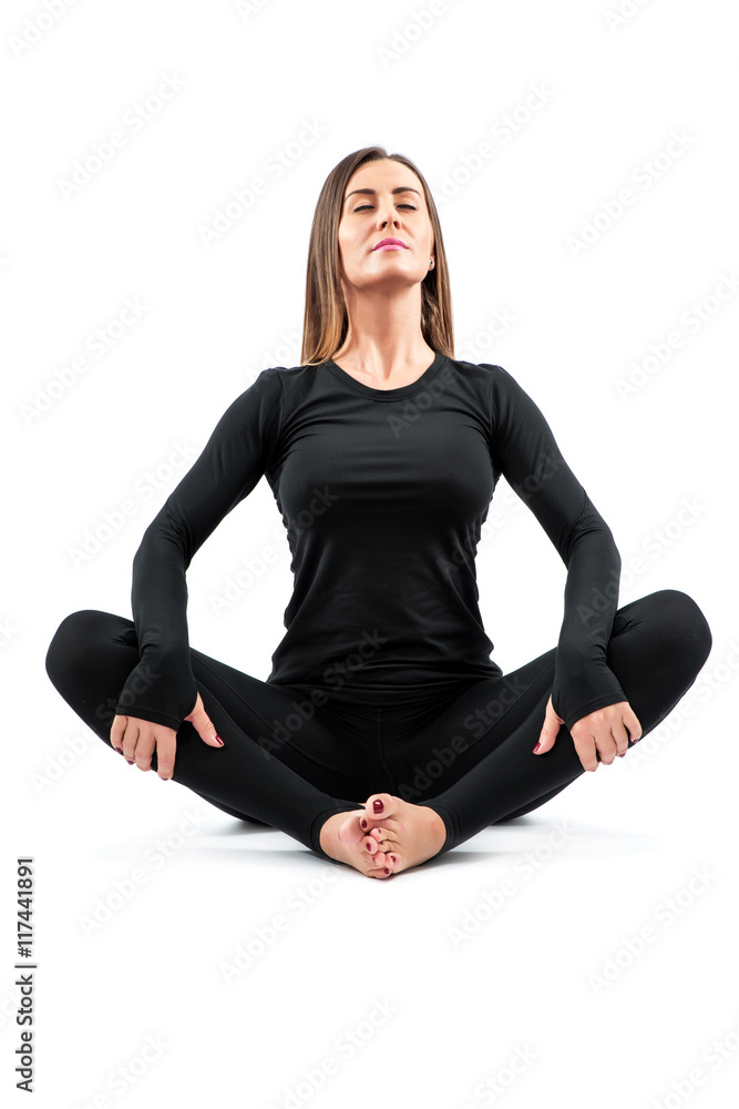 Woman practicing Yoga in a Studio Woman practicing Yoga in a Studio