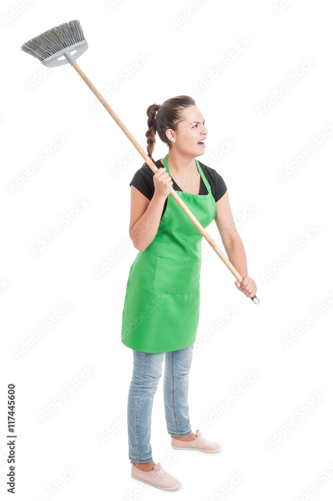 Angry employee acting violent with the broom Angry employee acting violent with the broom