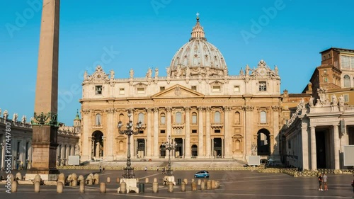 St. Peters Basilica in the morning in Vatican City - the most famous square almost empty of people in the area, blue cloudless sky at the background. Hyper-lapse