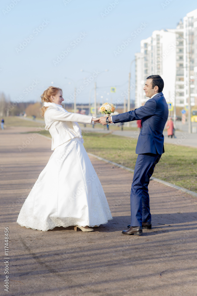 Young couple walk in the Park. Portrait of the bride and groom. Young couple walk in the Park. Portrait of the bride and groom.