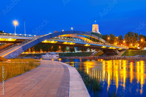 Night Gediminas Tower and King Mindaugas Bridge across Neris River in the city Vilnius, Lithuania, Baltic states.