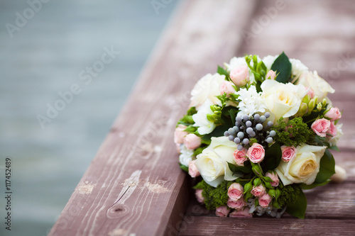 Beautiful wedding bouquet on vintage wooden background. Marriage concept