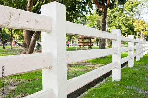 White Fences on grass in garden for background. photo