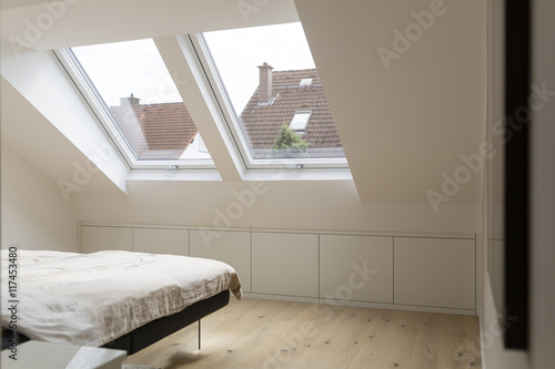 Windows in bedroom of a penthouse photo