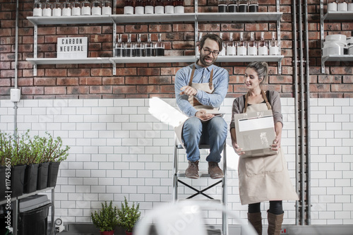Wallpaper Mural Two colleagues in storeroom discussing Torontodigital.ca
