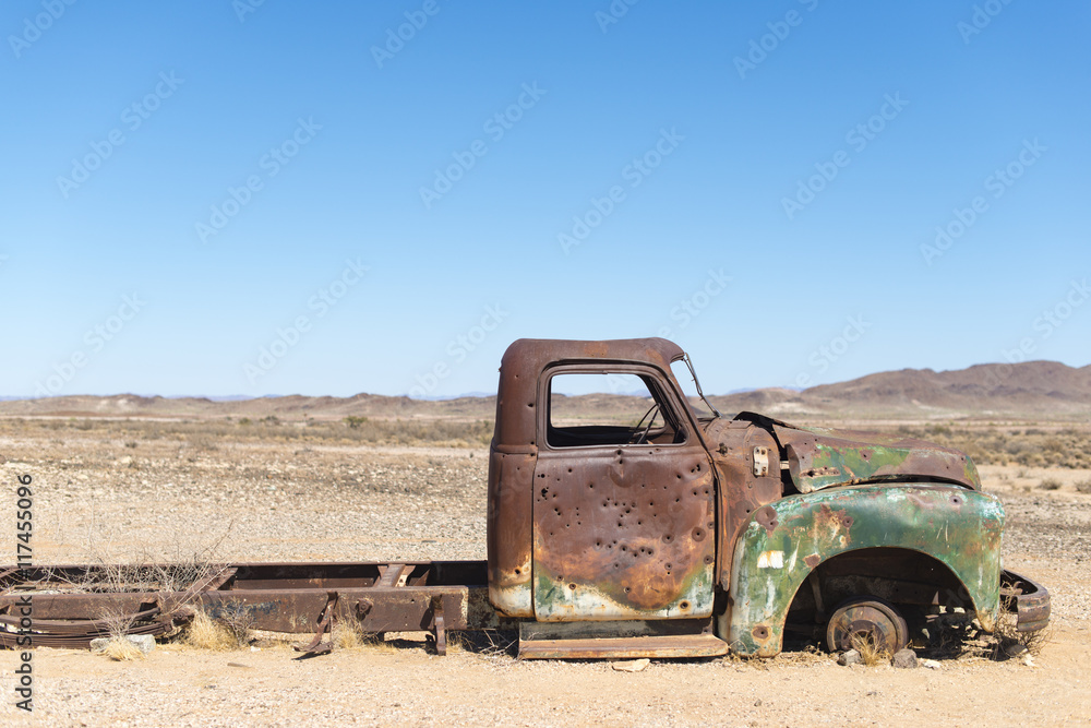 A rusty abandoned car in the desert near Aus in southern Namibia A rusty abandoned car in the desert near Aus in southern Namibia