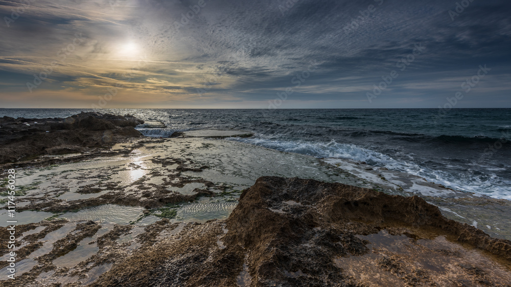 On the rocks... Photographed during amazing sunset at Mediterranean, Achzive shore, Israel, Mar 2016. On the rocks... Photographed during amazing sunset at Mediterranean, Achzive shore, Israel, Mar 2016.