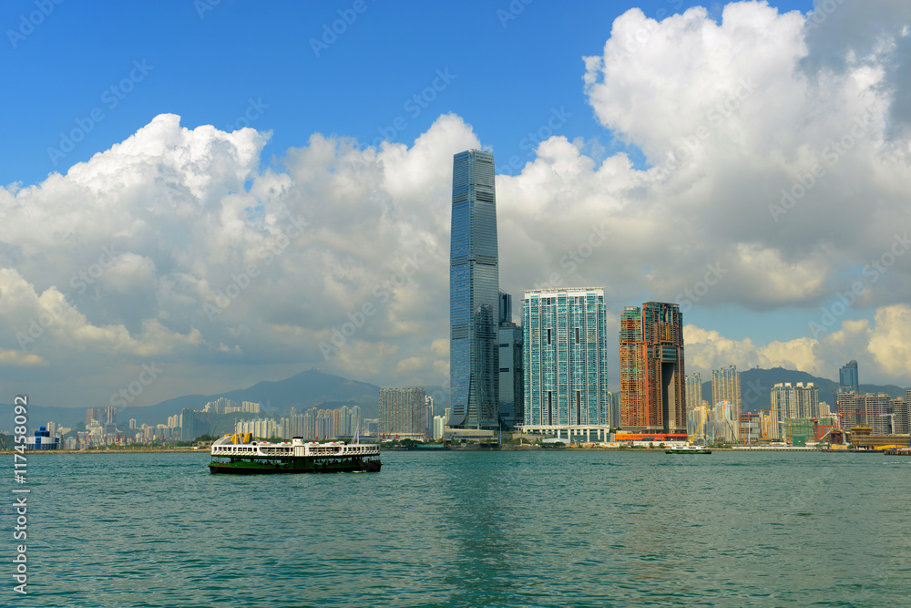 Hong Kong West Kowloon Skyline and Historical Star Ferry in Victoria Harbour, Kowloon, Hong Kong. The International Commerce Centre (ICC) at the center is the tallest building in Hong Kong.