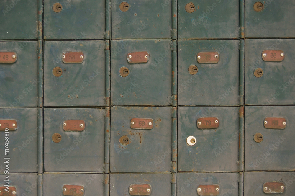 Wall of old green post office boxes in Sarawak, Malaysia