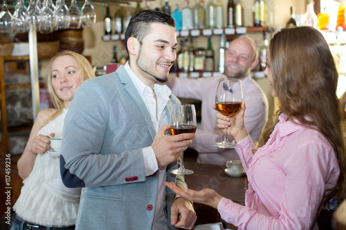 Restaurant visitors drinking wine