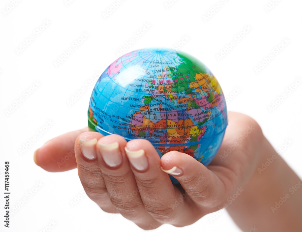 woman's hand with globe woman's hand with globe