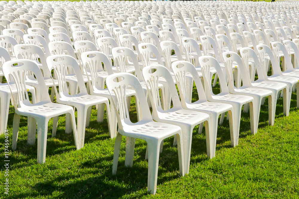 Fototapeta premium Rows of empty white chairs waiting for the audience