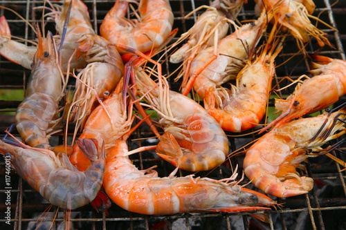 Grilled shrimps on the flaming grill.