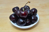 Fresh and sweet cherry in white bowl