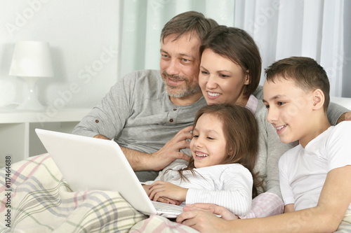 Happy family with laptop 