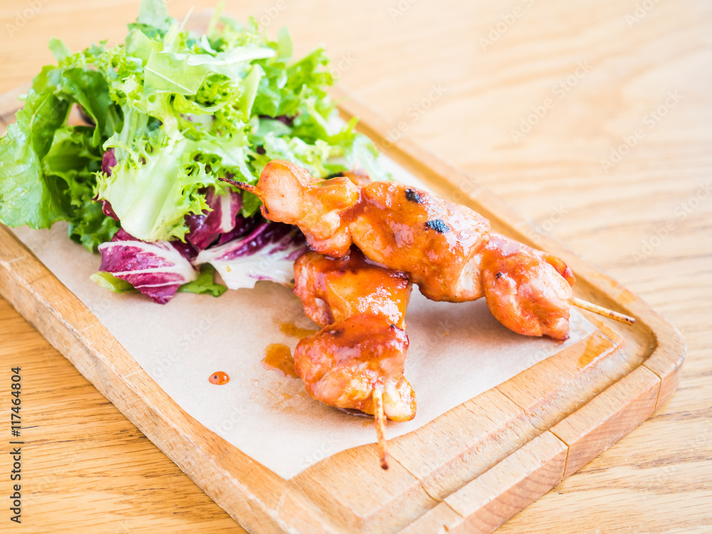 chicken with sauce on a skewer and vegetable chicken with sauce on a skewer and vegetable