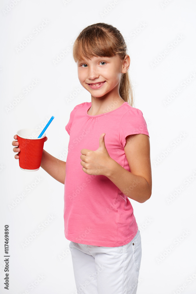 Little child girl holding a drink in disposable paper cup Little child girl holding a drink in disposable paper cup