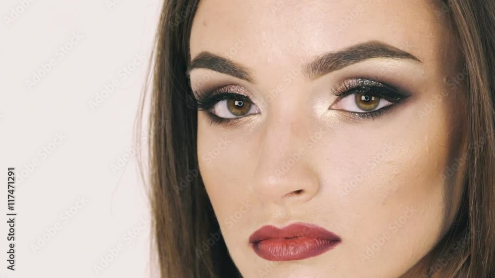 Close up serious look on camera of pretty girl. Slowly Close up serious look on camera of pretty girl. Slowly