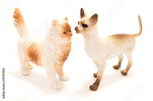 Toy cat from plastic on a white background. © chystmaks